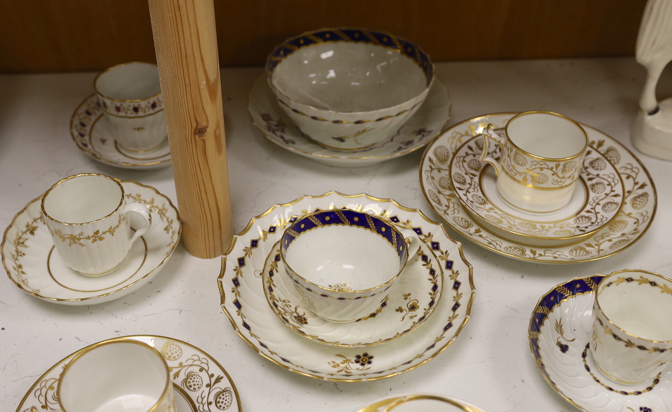 Two Flight Barr and Barr coffee can and matching saucer dish with gilded strawberries, four Flight cups and saucers, two Flight saucer dishes and a bowl together with a Chamberlain coffee can and saucer, bowl 15cm diamet